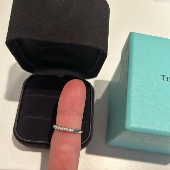 Tiffany & Co. Platinum and diamond half circle band ring. Total .17 ct